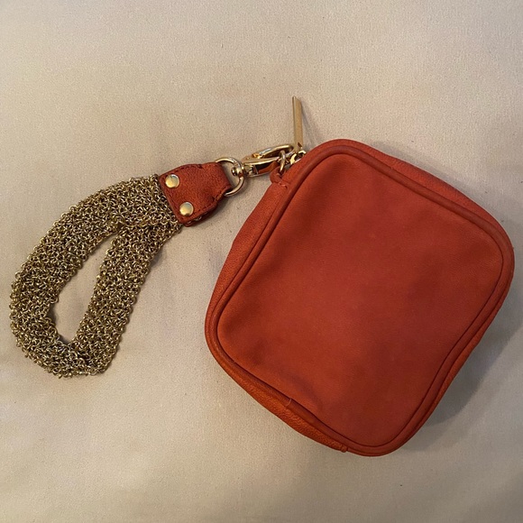 Uterque brand orange suede wristlet with gold tone chain wrist strap - Picture 1 of 4